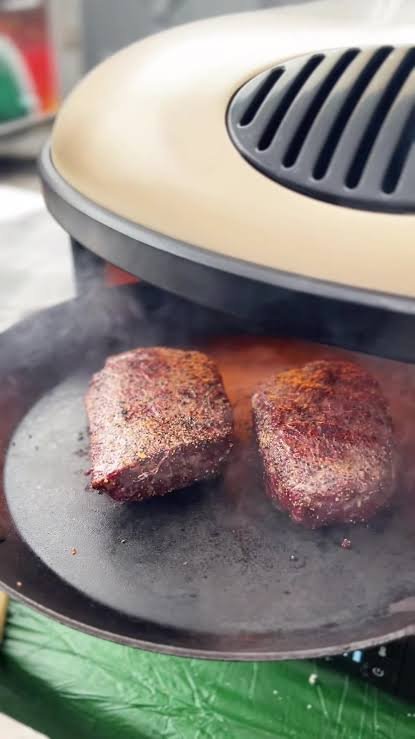 Outdoor cooking using a pizza oven