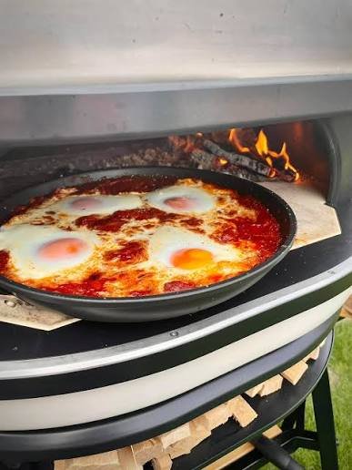 Food cooked in a pizza oven
